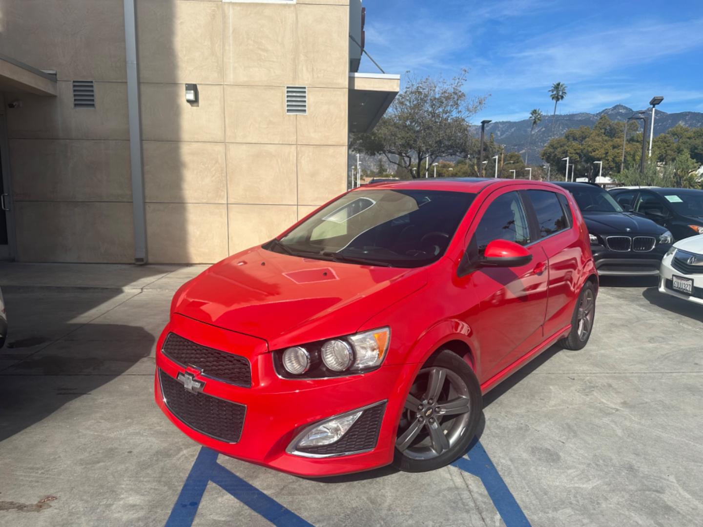 2013 Red /Black Chevrolet Sonic Cloth (1G1JG6SB3D4) with an 4 CYLINDER engine, Automatic transmission, located at 30 S. Berkeley Avenue, Pasadena, CA, 91107, (626) 248-7567, 34.145447, -118.109398 - The 2013 Chevrolet Sonic RS Auto 5-Door is a standout choice for drivers seeking a blend of style, performance, and practicality. At our Pasadena, CA dealership, we specialize in offering a wide array of used BHPH (Buy Here Pay Here) cars, including the dynamic Chevrolet Sonic RS. This detailed guid - Photo#0